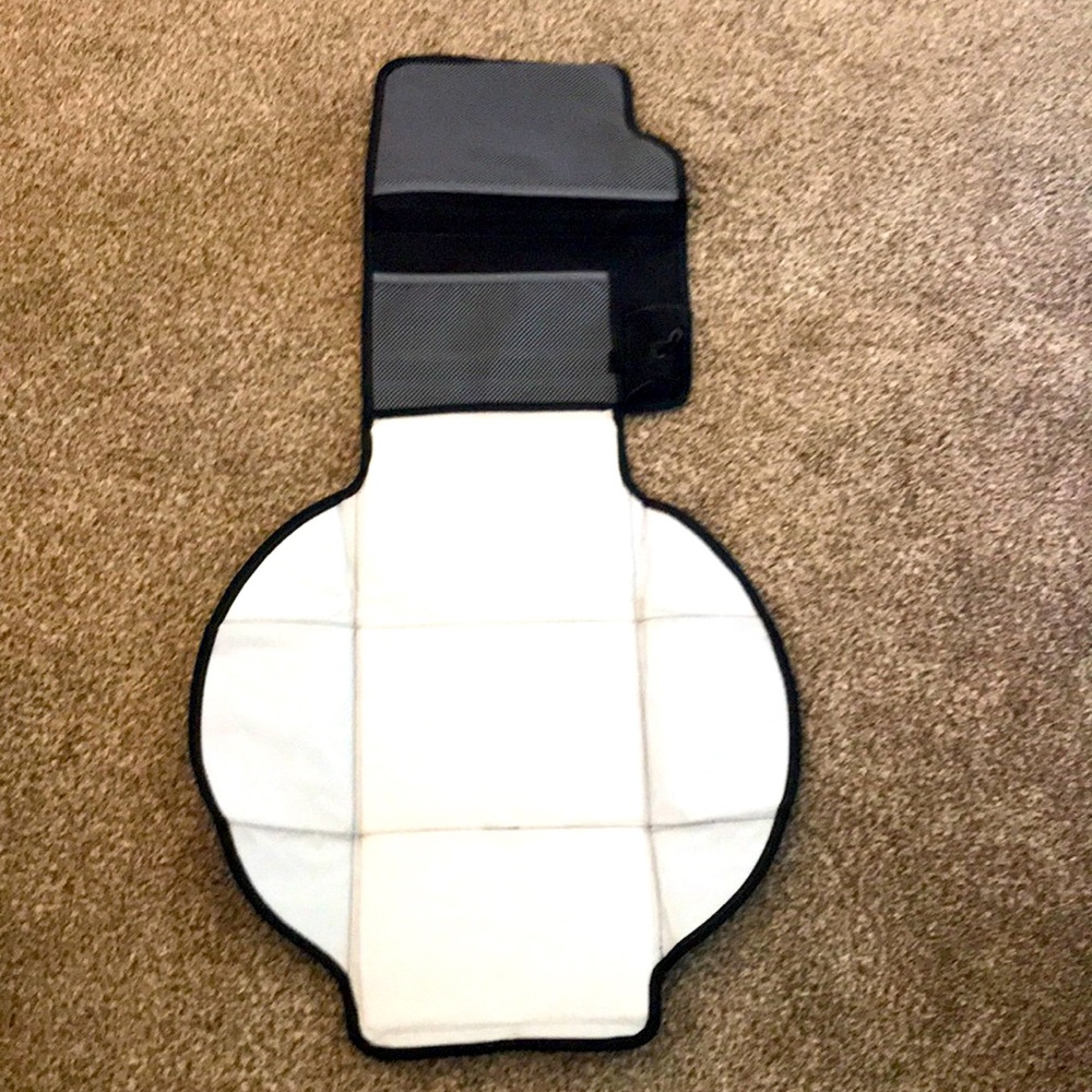 Diaper changer with pockets and bag holder